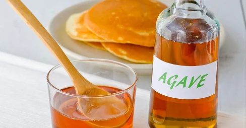 Agave syrup and a plate of pancakes