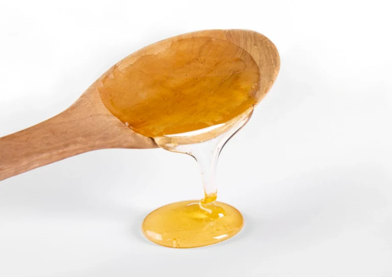 syrup on wooden spoon