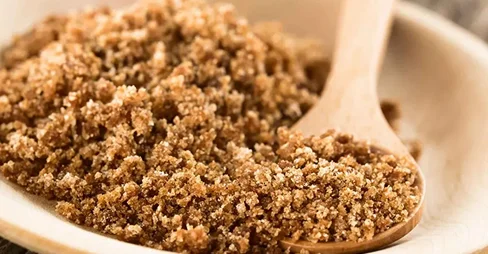 brown sugar on wooden plate