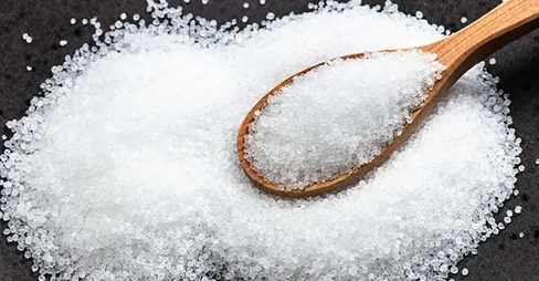 sugar in wooden spoon