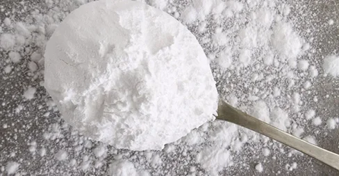 flour on metal spoon
