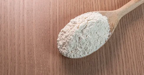 sugar in wooden spoon