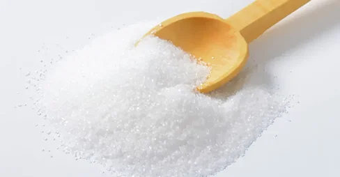 sugar in wooden spoon