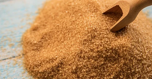 sugar on wooden spoon