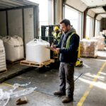 Bulk sugar delivery at food factory loading dock