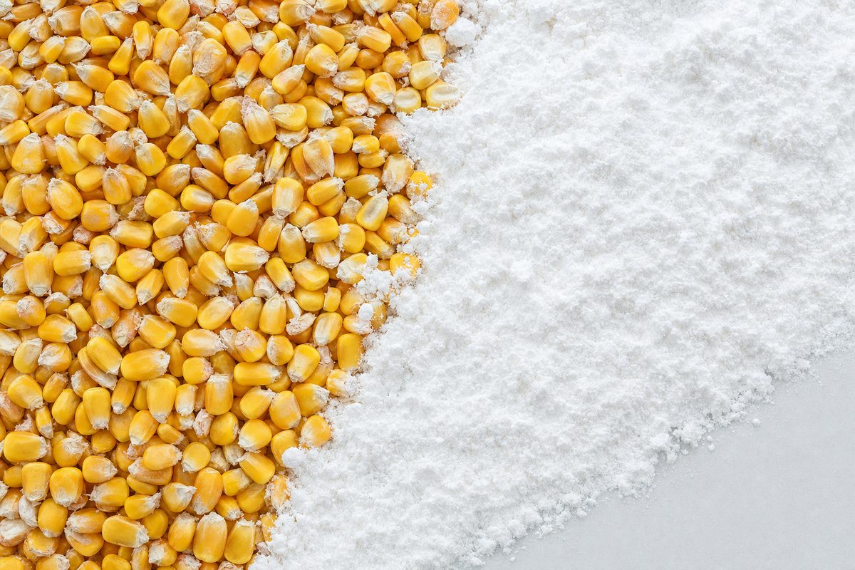 Non-GMO dextrose comparison showing identity-preserved corn kernels beside finished white corn sugar powder